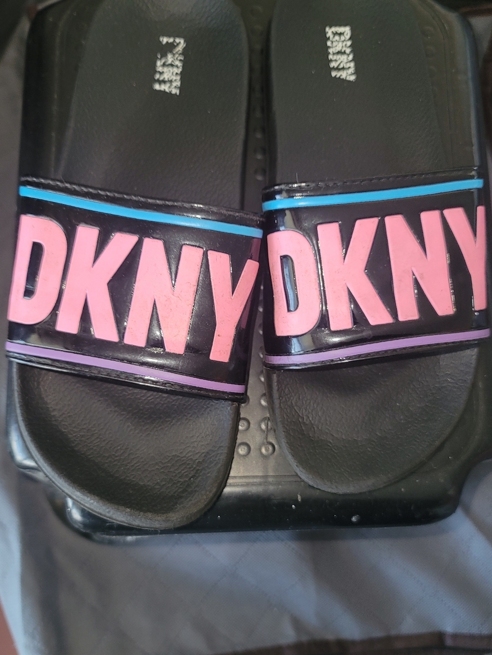 DKNY Black Slide Sandals with Pink Logo and Blue Accent